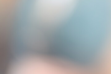 Abstract blue and beige blurry background with soft gradient tones