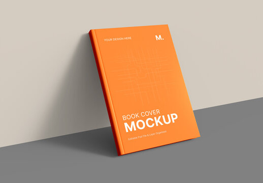 Orange Book Cover Leaning on Wall Mockup