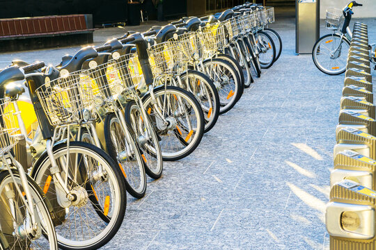 Hire bikes lined up in a row on a city street