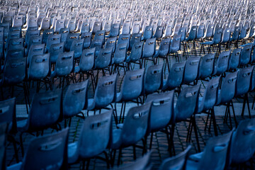 rows of blue seats in Vatican square