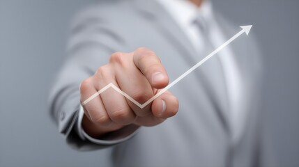 Businessman pointing at upward trend graph