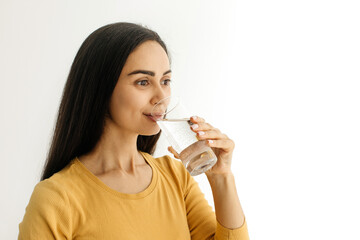 Body Hydration. Beautiful Young Woman Drinking Water From Glass At Home, Thirsty Millennial Lady...