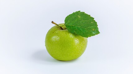 Fresh green apple with a leaf, captured from an overhead angle on a white surface, highlighting natural beauty
