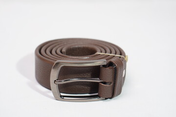 Genuine brown leather belt with a polished buckle, a versatile fashion essential.