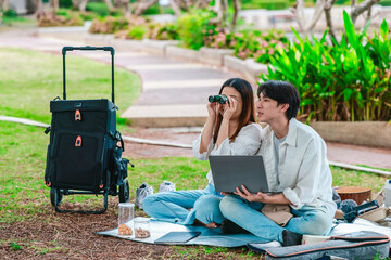Asian Couple Birdwatching with Binoculars