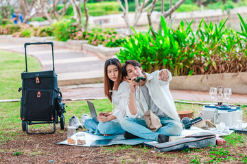 Asian Couple Birdwatching with Binoculars