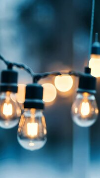 Illuminated light bulbs create a warm and inviting ambiance, perfect for outdoor gatherings or evening entertainment during the calm dusk