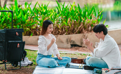 Asian Couple Playing Chess Outdoors
