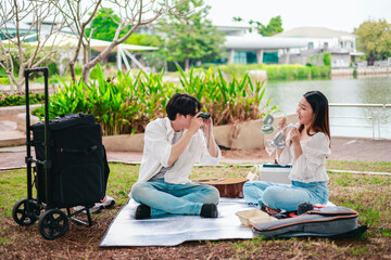 Asian Couple Enjoying Music Outdoors
