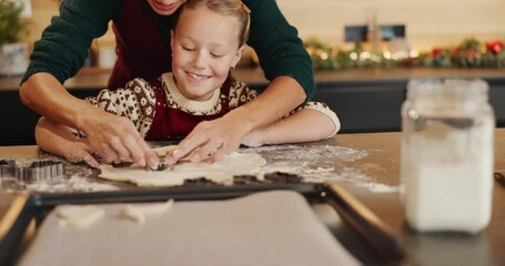 Christmas, baking and cookie cutter with child and mother together for learning and help. Bonding, tradition and family home to teach kid to bake homemade xmas treats to celebrate a christian holiday