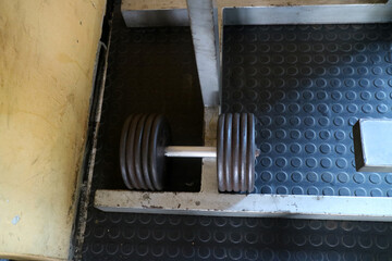 Heavy Dumbbell on Gym Floor