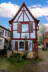 Small medieval half-timbered house with red beams and whitewashed walls, Rhineland-Palatinate,...