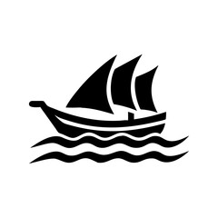 Silhouette of a sailboat with three sails on the water