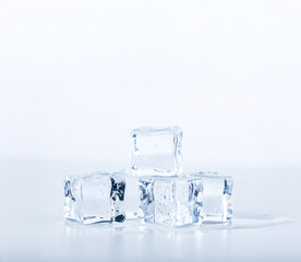 Small Melting Ice Cubes on White Background – Fresh Cold Concept for Drinks, Summer, and Refreshment Themes