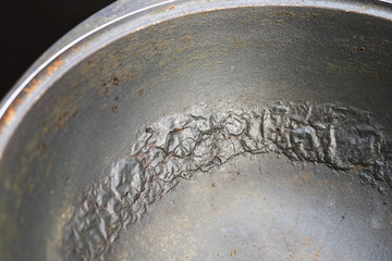 Damaged Interior of a Pot Peeling, Cracking, and Bubbling of Non-Stick Coating Revealed.