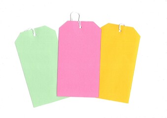Brightly coloured strung blank luggage tags with space for text of copy.