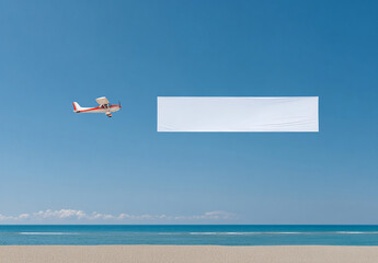 An airplane towing a blank banner over a tropical beach with blue skies and calm seas. Space for your advertising message in a paradisiacal setting.