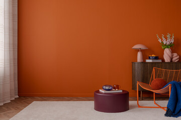 Minimalist and colorful interior with a vivid orange wall, dark wooden cabinet, and sculptural...