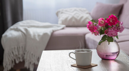 coxy interior with bouquet of roses and cup of coffee