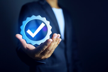 certificate concept with businessman holding a certified mark with check mark represent to get approved by standards and compliance of requirement