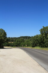 A road with trees on the side