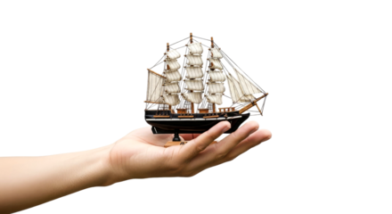 Hand Holding a Miniature Model Sailing Ship