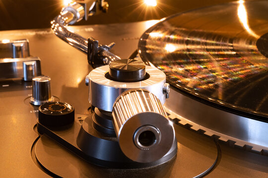 A tone arm for playing vinyl records and a cartridge for the record player. And a vinyl record.