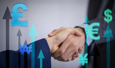 Closeup business people shaking hands overlay on currency symbol and growth arrow background. Business finance technology and investment concept