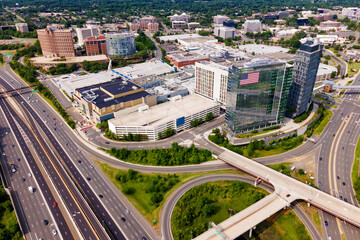 Aerial view of Tysons business district. Roads, buildings, and corporate offices.