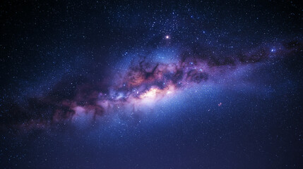 Fototapeta premium A stunning realistic view of the Milky Way galaxy in the night sky, showing countless stars, cosmic colors, and the vastness of space, perfect for astronomy or nature themes.