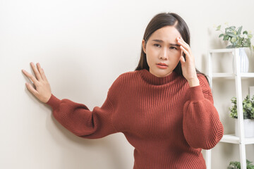 Dizzy asian young woman, girl headache or migraine pain. suffering from vertigo, difficulty...