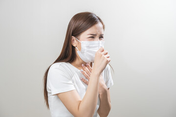 Unhealthy sickness, unwell asian young woman wearing mask coughing, have sore throat, suffering...