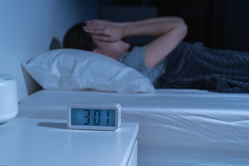 Annoyed, stressed, anxiety asian young woman suffering from insomnia, frustrated awake on bed at...