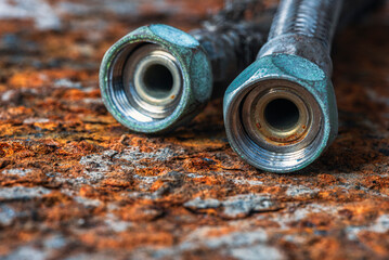 Water connection hose, close-up of the worn-out onnectors
