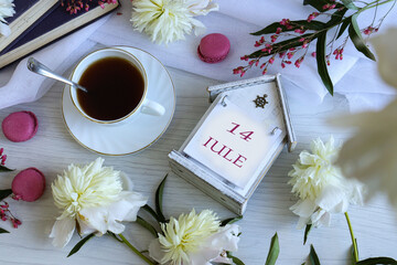 Calendar for June 14: number 14, name of the month June in English on a flip calendar among...