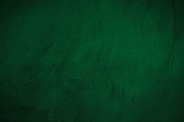 Abstract background of old dark green wall with black stains.
