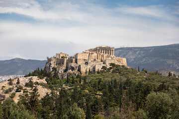 View of the Acropolis through branches of bush, Athens