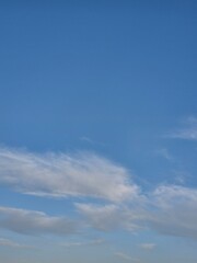 beautiful sky with clouds. clouds in the shape of chimeras. interesting shapes of white clouds on a blue sky background.