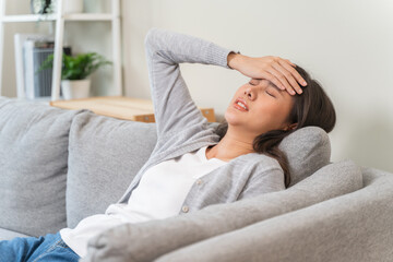 Young Asian females feeling dizzy after standing too fast, have symptoms of low blood pressure