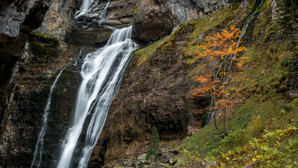 Stunning waterfall in Ordesa y Monte Perdido National Park, Huesca, Aragon, Spain, on a cold autumn day