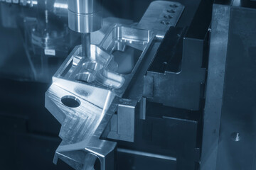 The 5-axis CNC milling machine cutting the aerospace part with solid ball end mill tool in the...