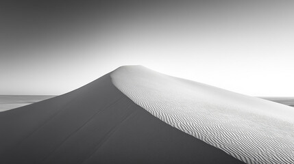 Solitary Sand Dune at Sunset with Monochrome Beige Texture, Soft Shadows, and a Distant Flat Horizon Under a Golden Sky.