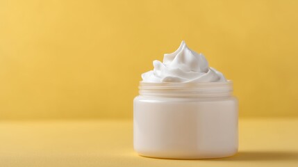 Luxurious cream jar filled with whipped body butter showcasing thick white texture and rich consistency in soft natural light