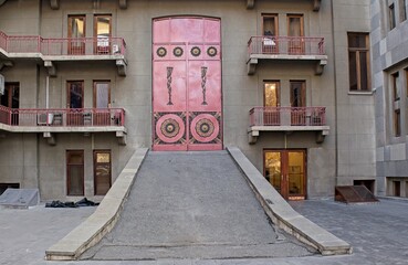 red wooden door with tile trim at the yerevan