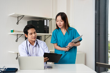 doctor and nurse is discussing and brainstorming on patient medical record after diagnosis for...