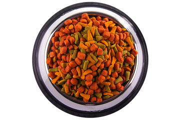 colored cat or dog kibble in a metal bowl isolated. Nutritious healthy diet pet food scattered around, falls and cascades the bowl. Dry cat or dog food spills from a bowl.