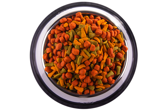 colored cat or dog kibble in a metal bowl isolated. Nutritious healthy diet pet food scattered around, falls and cascades the bowl. Dry cat or dog food spills from a bowl.