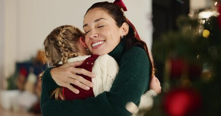 Christmas, hug and smile of mother with daughter in living room of home for festive celebration. December, love or winter with girl child and single parent woman embracing in apartment for holidays - Powered by Adobe