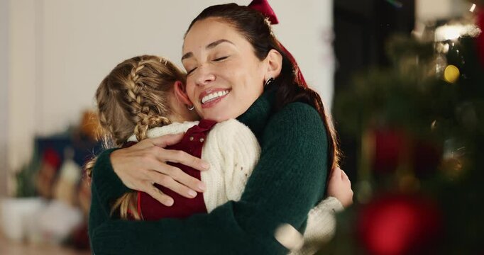 Christmas, hug and smile of mother with daughter in living room of home for festive celebration. December, love or winter with girl child and single parent woman embracing in apartment for holidays - Powered by Adobe