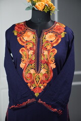 Kashmiri pheran displayed on a mannequin in Kashmir